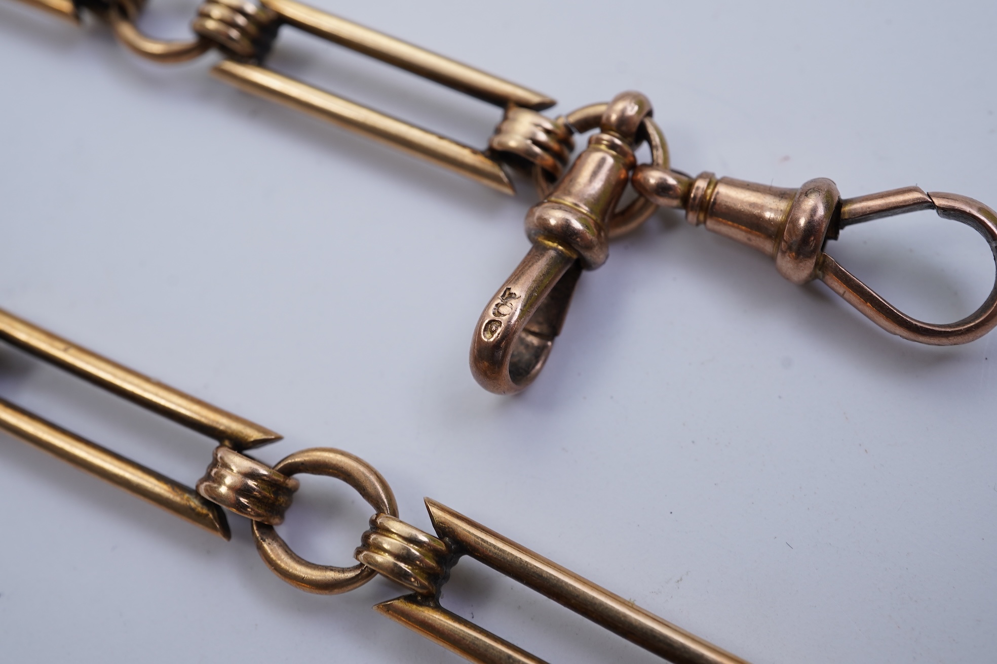 A continental 18k gold open faced keyless lever pocket watch, with a 9ct albert